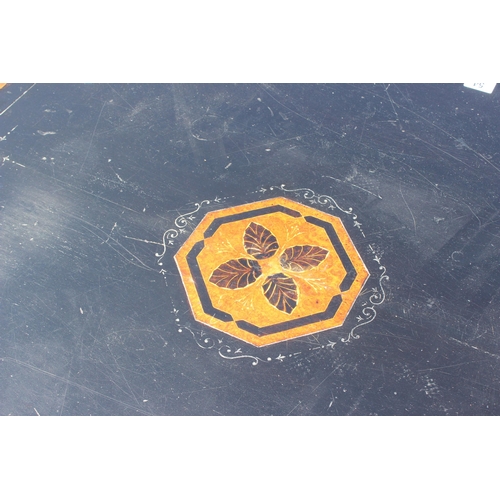 54 - A late Victorian or Edwardian ebonised and amboyna octagonal library or centre table with inlay, app... 