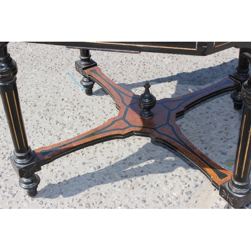 54 - A late Victorian or Edwardian ebonised and amboyna octagonal library or centre table with inlay, app... 