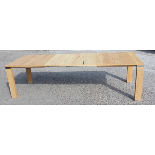 76A - A rare Venjako retro style extending dining table in Santana light oak with chrome fittings, approx ... 