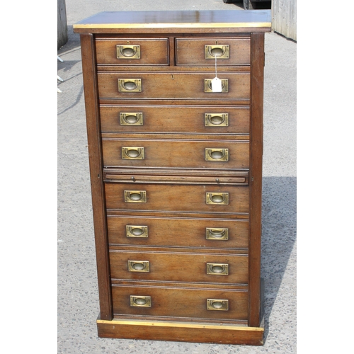 84 - An early 20th century style mahogany campaign Wellington chest formed as 2 short drawers over 7 long... 