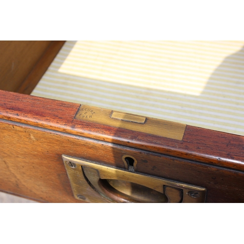 84 - An early 20th century style mahogany campaign Wellington chest formed as 2 short drawers over 7 long... 