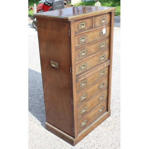 84 - An early 20th century style mahogany campaign Wellington chest formed as 2 short drawers over 7 long... 