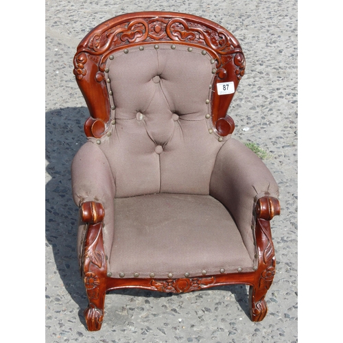 87 - An antique style miniature chair formed as Victorian button backed nursing chair, approx 54cm tall