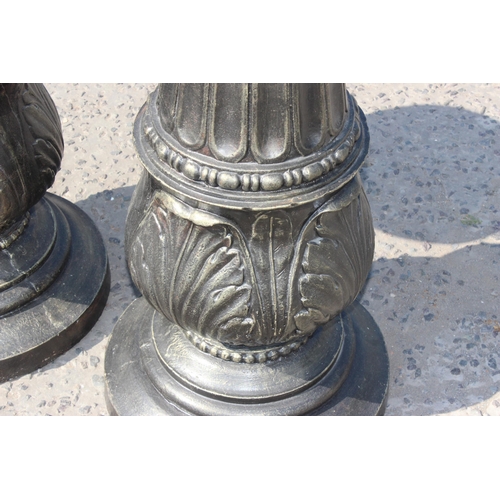 93 - In the manner of J.J. Ducel of Paris, a large pair of bronze patinated cast iron columns or pedestal... 