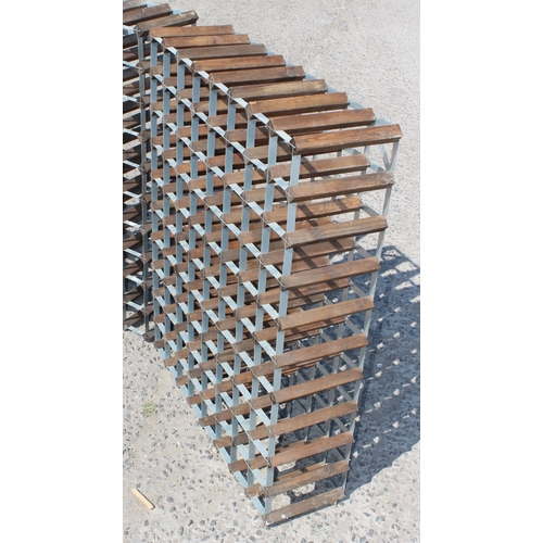 94 - A pair of 80 bottle wooden and metal wine racks