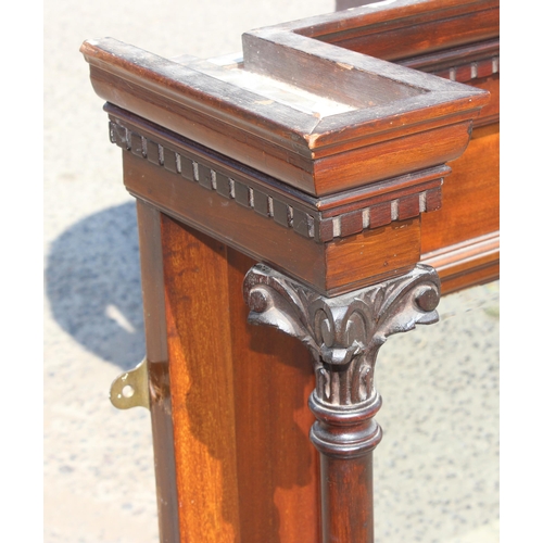 97 - An antique mahogany framed overmantel mirror with carved pillars, approx 140cm wide x 100cm tall