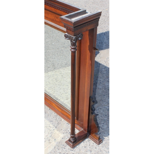 97 - An antique mahogany framed overmantel mirror with carved pillars, approx 140cm wide x 100cm tall