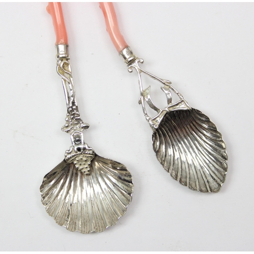 1049 - 2 Italian 800 silver and coral handled spoons, one for Parmesan and the other for sugar, both with b... 