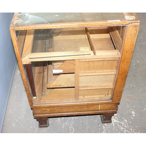 82 - An early 20th century light oak haberdashery shop counter or display cabinet with 15 drawers with br... 