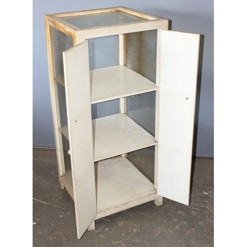 83 - A vintage white painted glazed shop display cabinet with 3 glazed sides and 2 rear doors, approx 53c... 