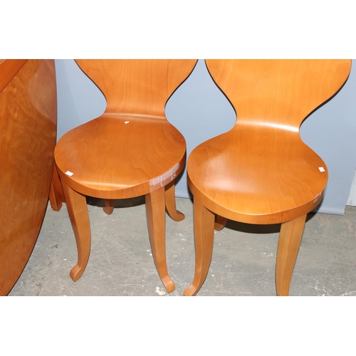 76 - A retro style dropleaf table and a set of 6 unusual bentwood chairs. seemingly unmarked, the table w... 