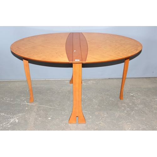 76 - A retro style dropleaf table and a set of 6 unusual bentwood chairs. seemingly unmarked, the table w... 