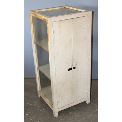 83 - A vintage white painted glazed shop display cabinet with 3 glazed sides and 2 rear doors, approx 53c... 