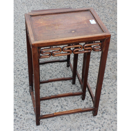 46 - An early 20th century Chinese hardwood nest of 3 tables, the largest approx 37cm wide x 60cm tall