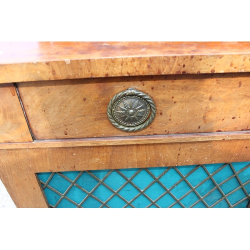 34 - A 19th century mahogany hall cupboard or small sideboard with a single drawer over 2 cupboard doors ... 