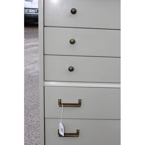 23 - A retro green painted G-Plan 7 drawer chest of drawers. approx 66cm wide x 134cm tall x 40cm deep