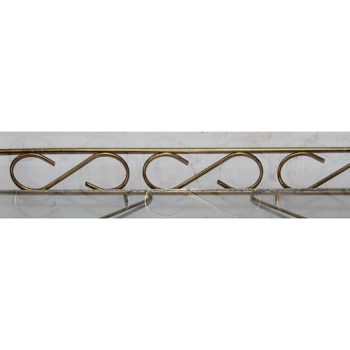 27 - A retro gilt wrought metal and glass serving trolley, approx 47cm wide