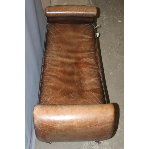 9 - A Regency style scroll arm window seat with brown leather upholstery and studded decoration, bearing... 
