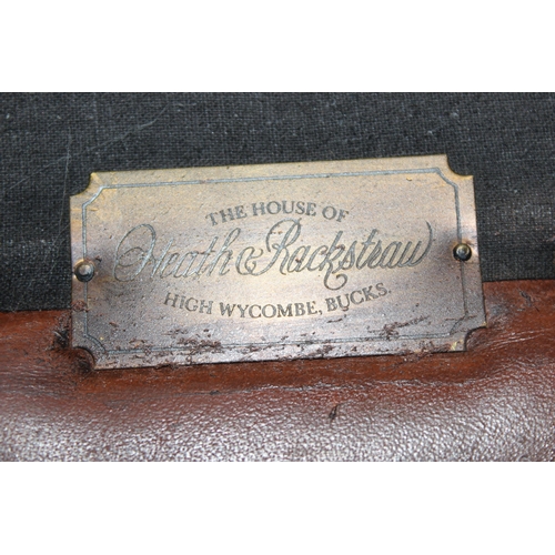 9 - A Regency style scroll arm window seat with brown leather upholstery and studded decoration, bearing... 