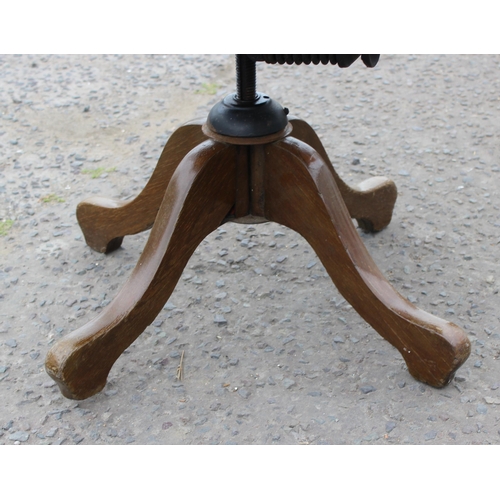 5 - An early 20th century oak slat back office chair