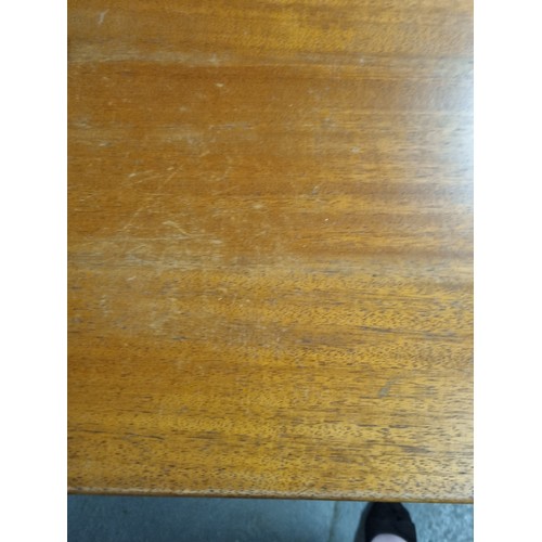 55A - A retro A.H. McIntosh of Kirkcaldy teak sideboard, with three central short drawers, the top drawer ... 