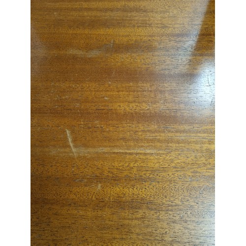55A - A retro A.H. McIntosh of Kirkcaldy teak sideboard, with three central short drawers, the top drawer ... 