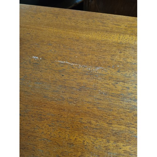 55A - A retro A.H. McIntosh of Kirkcaldy teak sideboard, with three central short drawers, the top drawer ... 