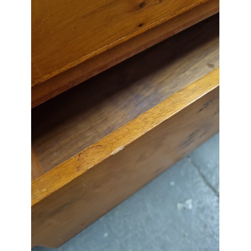 55A - A retro A.H. McIntosh of Kirkcaldy teak sideboard, with three central short drawers, the top drawer ... 