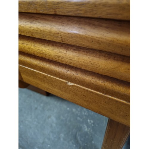 55A - A retro A.H. McIntosh of Kirkcaldy teak sideboard, with three central short drawers, the top drawer ... 