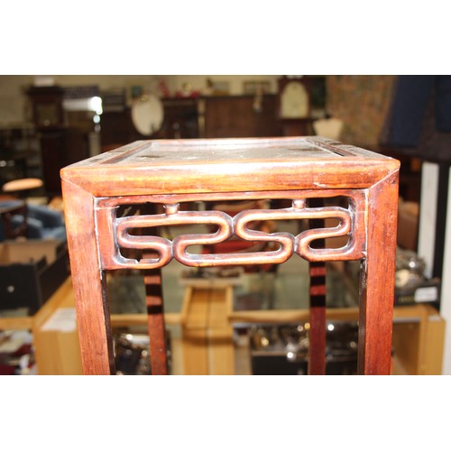 46 - An early 20th century Chinese hardwood nest of 3 tables, the largest approx 37cm wide x 60cm tall