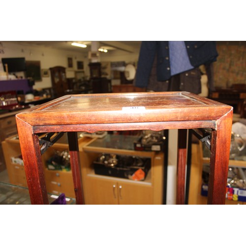 46 - An early 20th century Chinese hardwood nest of 3 tables, the largest approx 37cm wide x 60cm tall