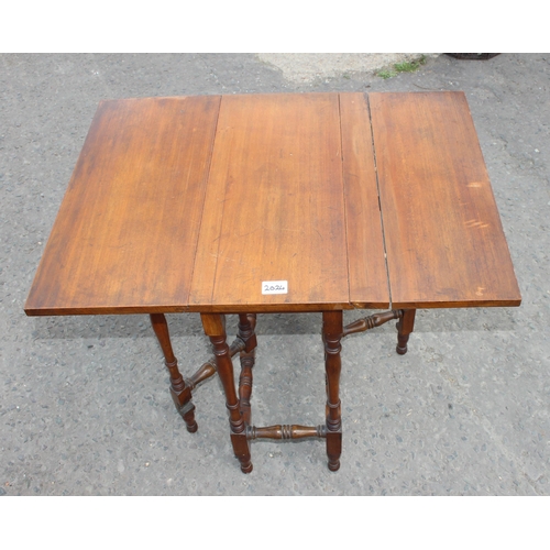 30 - A small antique mahogany Sutherland table with turned legs and a mahogany stool with Pheasant tapest... 