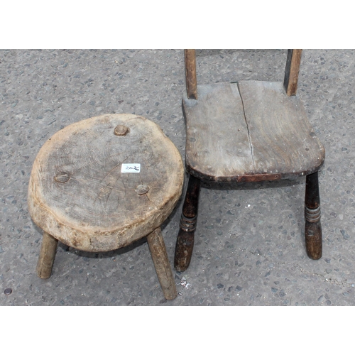 27 - A rustic 3 legged milking stool and a small elm child's Oxford chair (2)