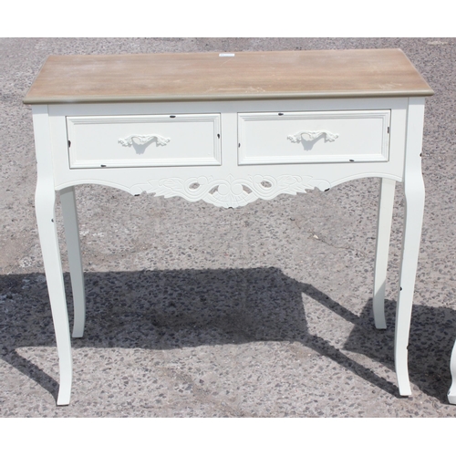 74 - A white painted hall table with 2 drawers and a similar painted bedside cabinet, the table approx 90... 