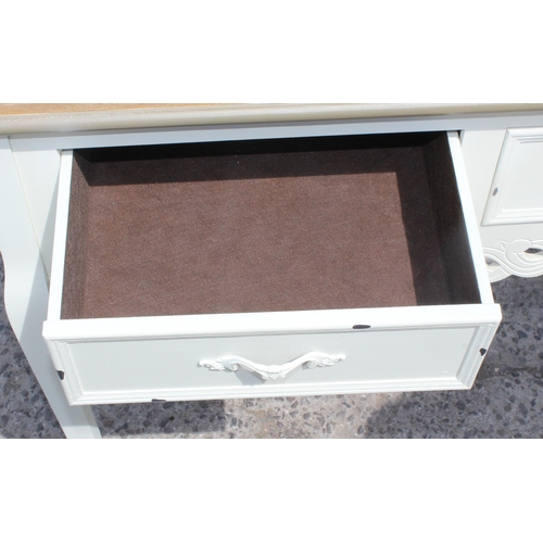 74 - A white painted hall table with 2 drawers and a similar painted bedside cabinet, the table approx 90... 