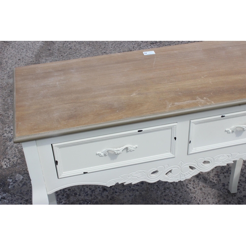 74 - A white painted hall table with 2 drawers and a similar painted bedside cabinet, the table approx 90... 