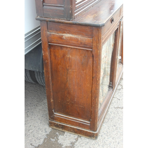 22 - An unusual antique oak display cabinet with 2 pairs of glazed doors and 2 slim drawers, approx 143cm... 