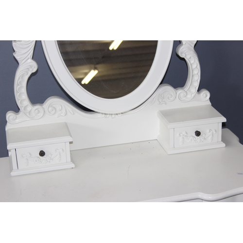 48 - A pair of vintage style white painted dressing table with decorative floral swags and metal handles,... 