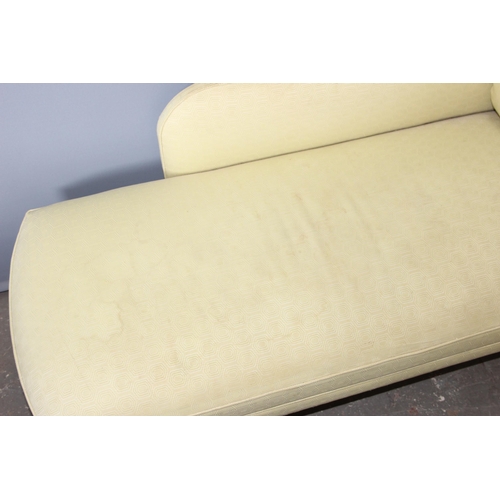 49 - A modern yellow upholstered chaises longue with matching cushion, approx 160cm wide x 60cm deep x 85... 