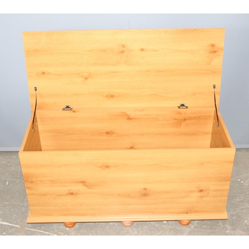 103 - Pine effect storage trunk, approx 100cm wide x 44cm deep x 48cm tall