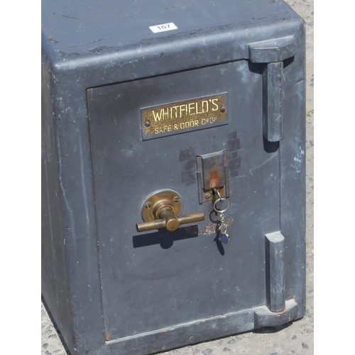 107 - A vintage Whitfield's cast iron safe with key, approx 42cm wide x 46cm deep x 58cm tall