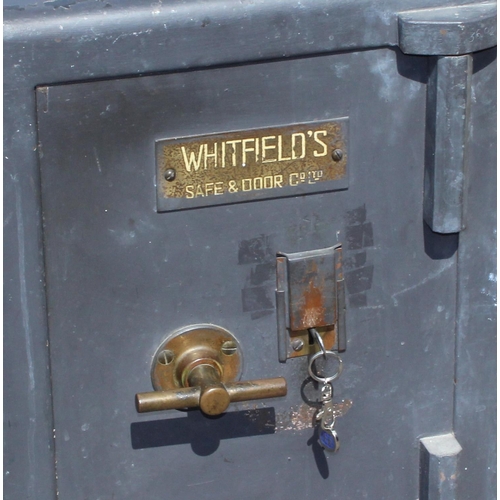 107 - A vintage Whitfield's cast iron safe with key, approx 42cm wide x 46cm deep x 58cm tall