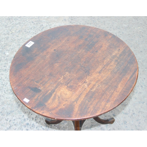 111 - A small antique wooden tilt top mahogany table with unusual tripod base, approx 55cm in diameter