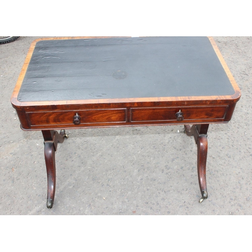 118 - An antique mahogany leather topped library or sofa table with 2 drawers and 2 false drawers, approx ... 