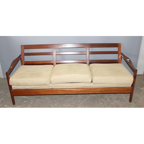 4A - A retro 1960's teak framed 3 seater sofa with cushions, seemingly unmarked but likely Scandinavian, ... 