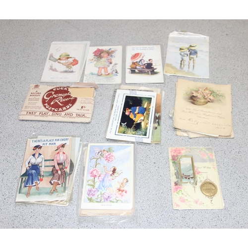 Box of assorted antique and vintage postcards, many humorous examples