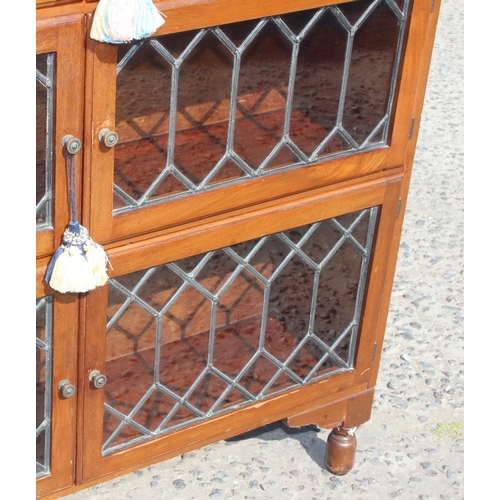 57 - A vintage Globe Wernicke style mahogany bookcase with leaded glass opening doors, approx 89cm wide x... 