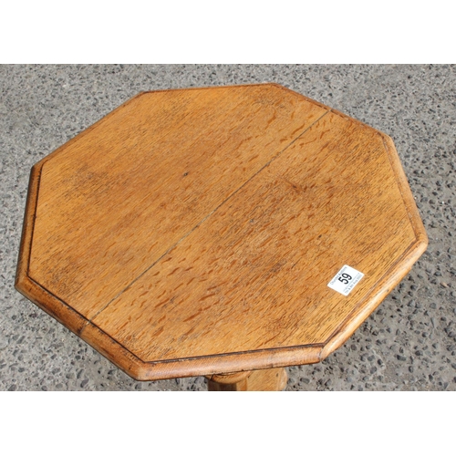 59 - An early 20th century light oak Gothic revival side table of octagonal form, approx 48cm wide x 75cm... 