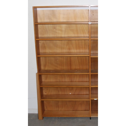 63 - A retro double bookcase with adjustable shelves, seemingly unmarked, approx 183cm wide x 20cm deep x... 