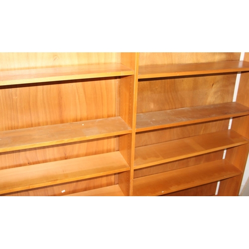 63 - A retro double bookcase with adjustable shelves, seemingly unmarked, approx 183cm wide x 20cm deep x... 